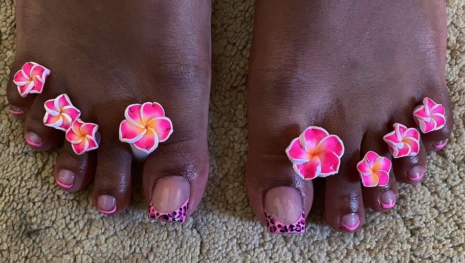 Vibrant floral toe nail art at shine.haus.studio, Oxnards, Saint James, BB, showcasing skilled pedicure design.