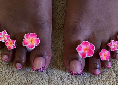 Vibrant floral toe nail art at shine.haus.studio, Oxnards, Saint James, BB, showcasing skilled pedicure design.