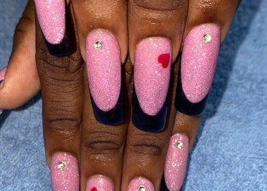Sparkling pink nails with black tips and gems at shine.haus.studio, Oxnards, Saint James, BB.