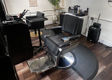 Tristen Graves salon in Ridgefield, Washington, US features a sleek black styling chair.