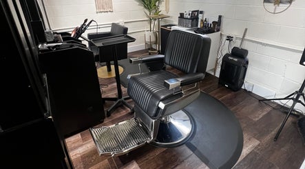 Tristen Graves salon in Ridgefield, Washington, US features a sleek black styling chair.