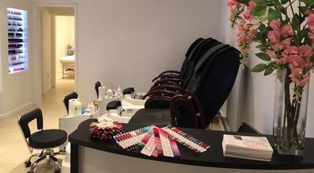 The Nail Boutique in Hersham, England, GB, showcasing modern pedicure stations and colorful nail polish collection.