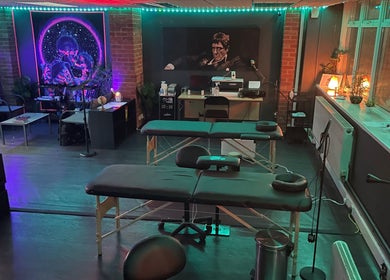 Modern tattoo studio at MJ ink tattoos, Barking, England, GB with ambient lighting and artistic decor.