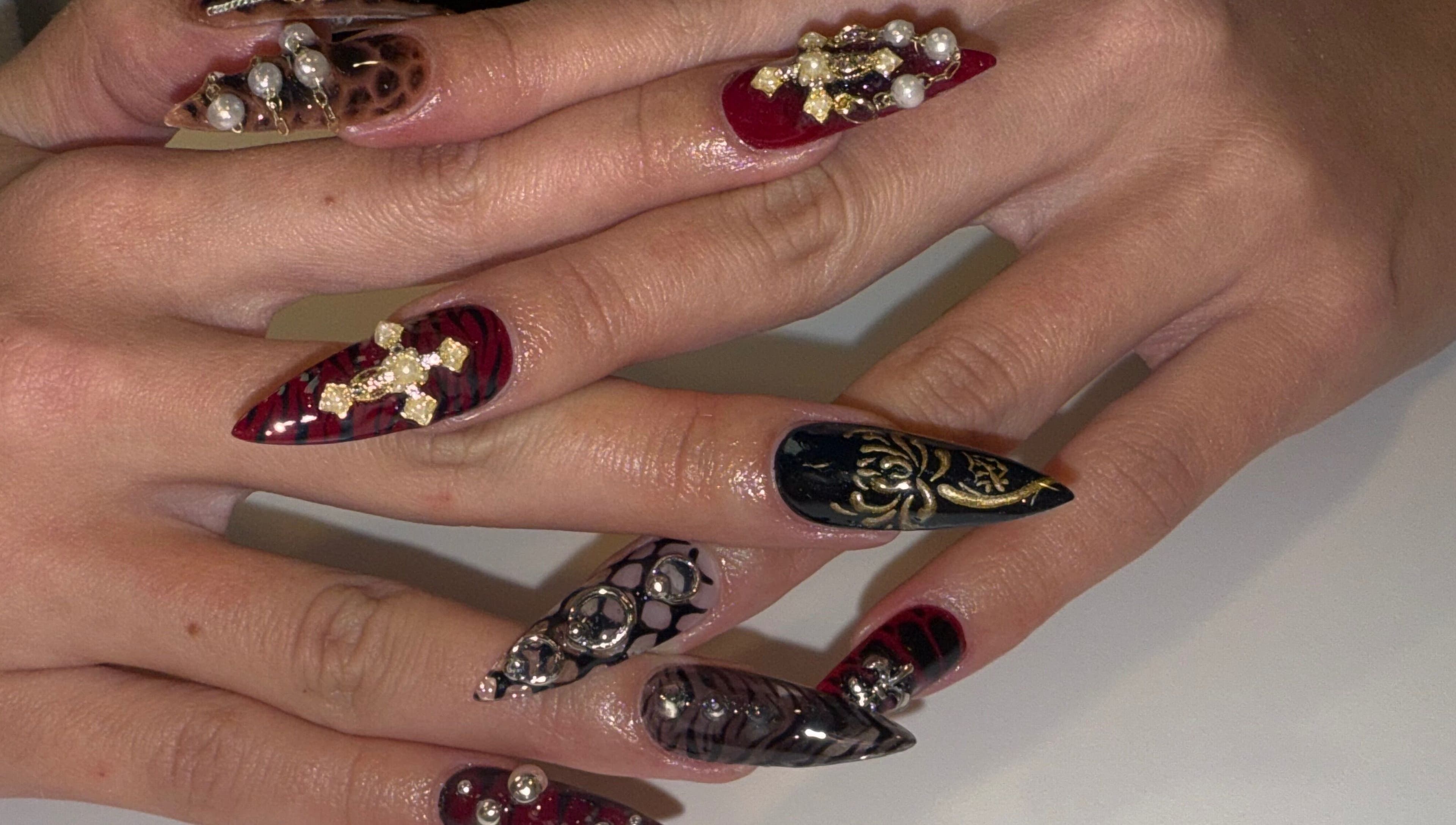 Intricate nail art with jewels at Squid Nails, Coquitlam, British Columbia, CA.