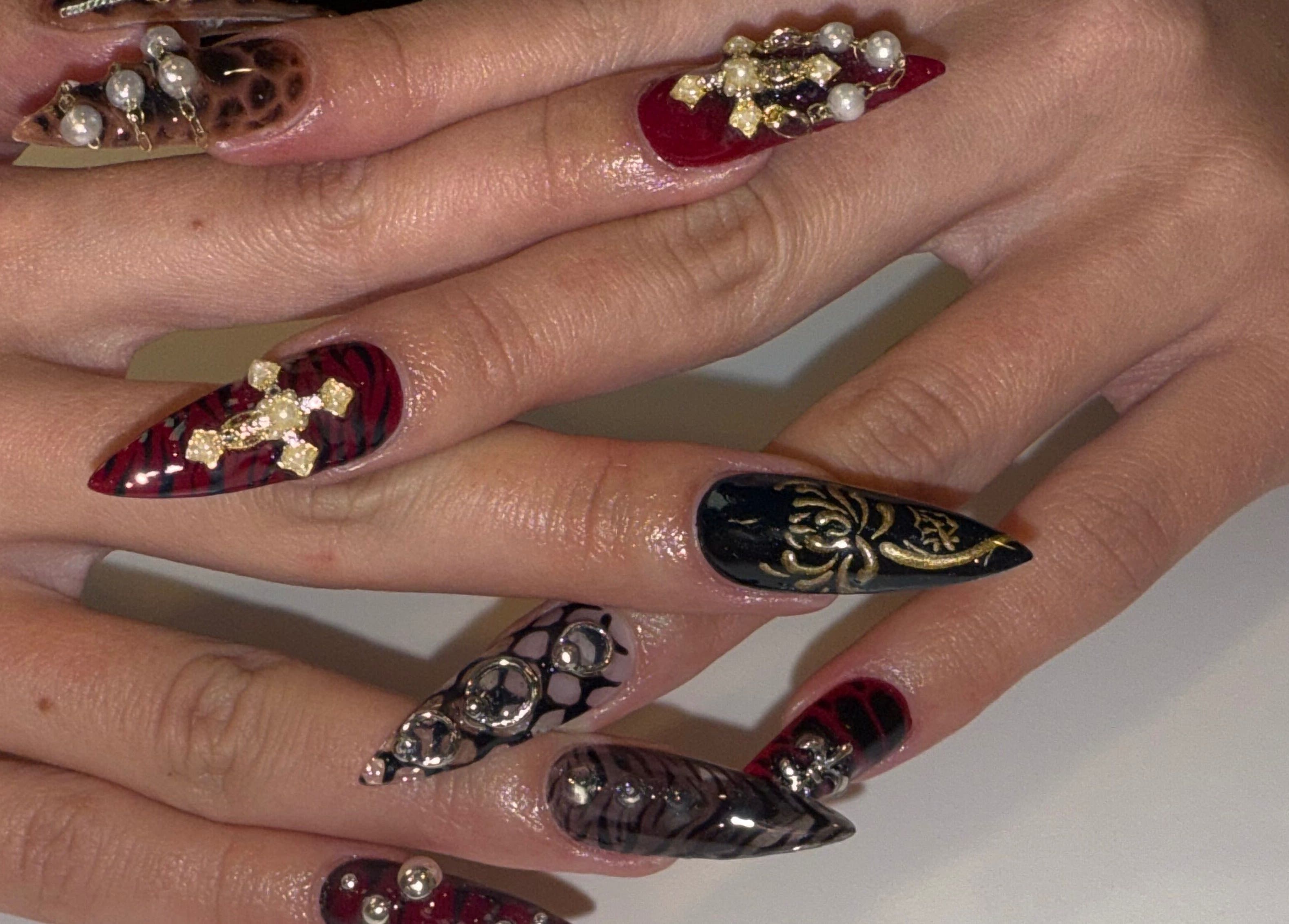 Intricate nail art with jewels at Squid Nails, Coquitlam, British Columbia, CA.