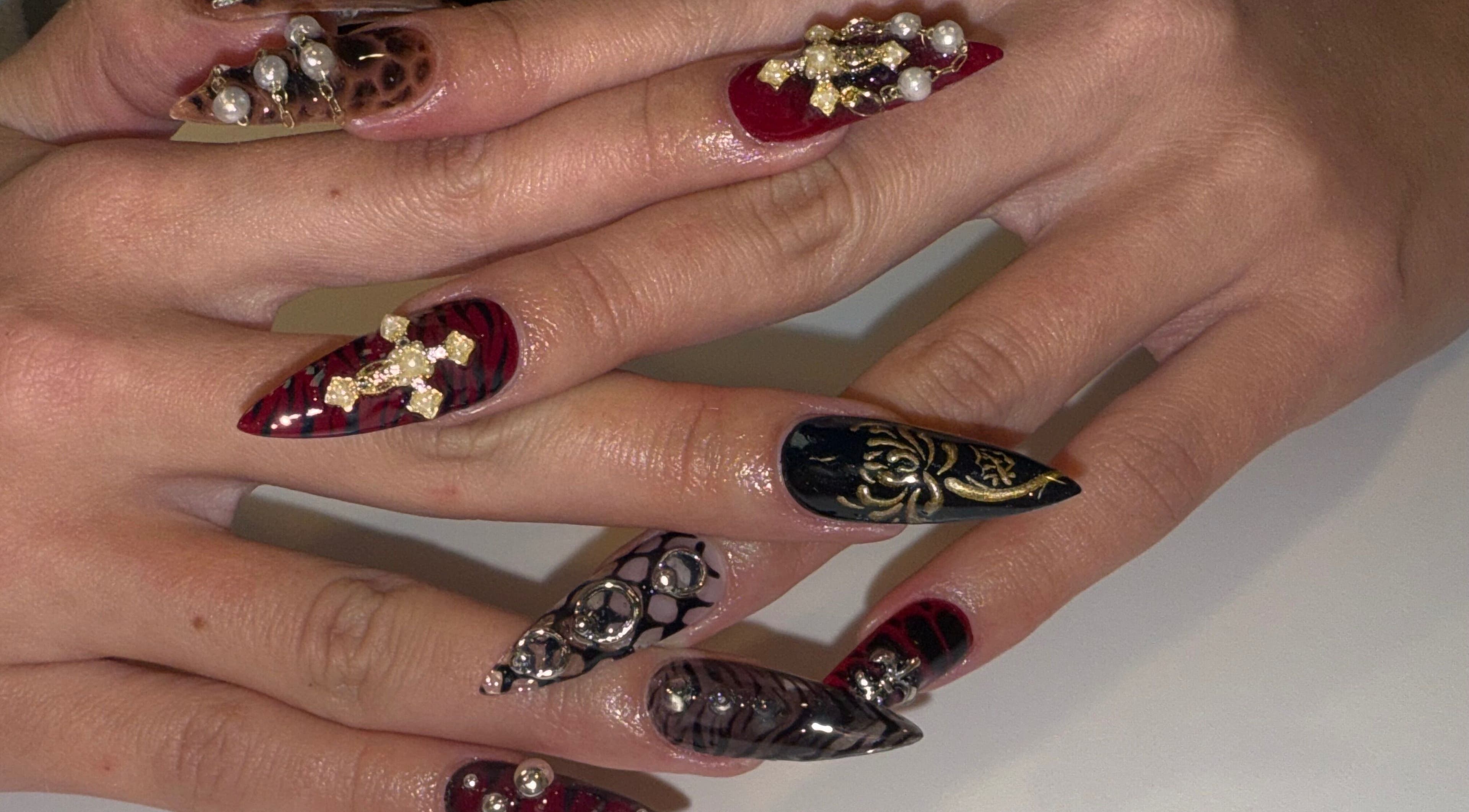 Intricate nail art with jewels at Squid Nails, Coquitlam, British Columbia, CA.