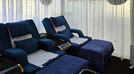 Relaxing lounge at AiRelax® Spa featuring plush seating, Auckland, Auckland, NZ.