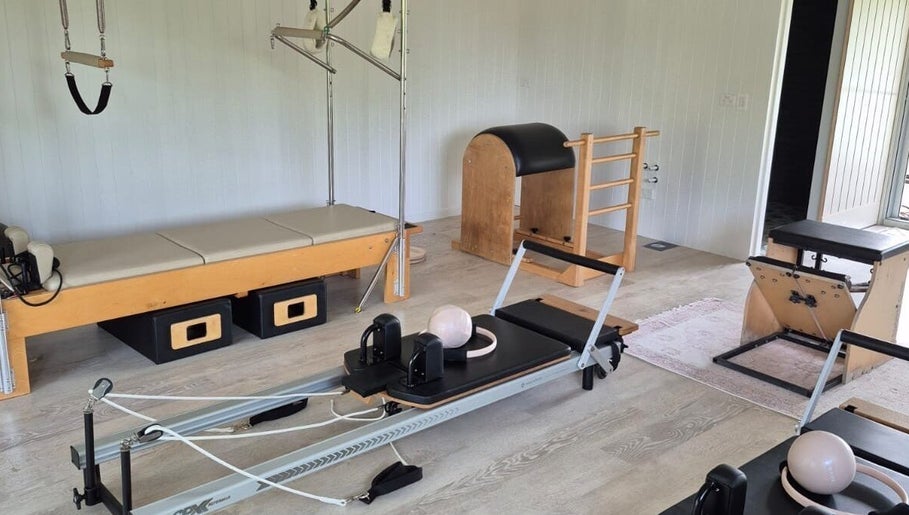 Pilates equipment at Pilates@The Honey Homestead, Piggabeen, New South Wales, AU. Inviting wellness space.