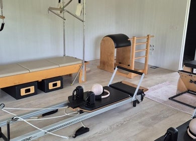 Pilates equipment at Pilates@The Honey Homestead, Piggabeen, New South Wales, AU. Inviting wellness space.