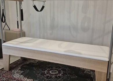 Pilates reformer at Pilates@The Honey Homestead, Piggabeen, New South Wales, AU, set in a calming environment.