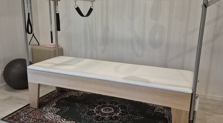 Pilates reformer at Pilates@The Honey Homestead, Piggabeen, New South Wales, AU, set in a calming environment.
