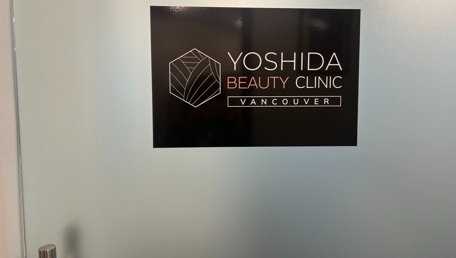 YOSHIDA BEAUTY CLINIC 【Broadway Location】 sign on glass door, Vancouver, British Columbia, CA.