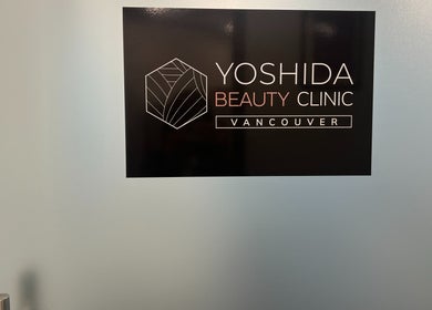 YOSHIDA BEAUTY CLINIC 【Broadway Location】 sign on glass door, Vancouver, British Columbia, CA.