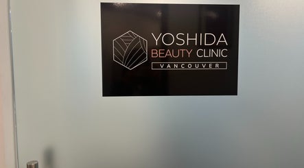 YOSHIDA BEAUTY CLINIC 【Broadway Location】 sign on glass door, Vancouver, British Columbia, CA.