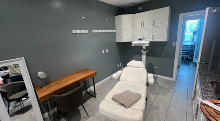 YOSHIDA BEAUTY CLINIC room in Vancouver, BC, CA with modern chair and wooden desk.
