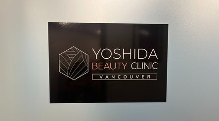 Sign of YOSHIDA BEAUTY CLINIC located in Vancouver, British Columbia, CA, showcasing elegant design.
