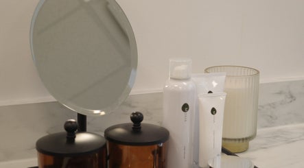 Chic vanity setup with skincare products and mirror at YOSHIDA BEAUTY CLINIC 【Downtown Location】, Vancouver, British Columbia, CA.