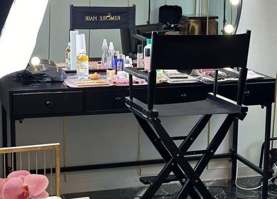 Makeup station at Remorehair, Sandton, Gauteng, ZA with cosmetics and styling tools, highlighting a chic salon ambiance.