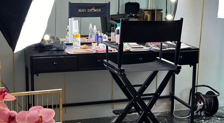 Makeup station at Remorehair, Sandton, Gauteng, ZA with cosmetics and styling tools, highlighting a chic salon ambiance.