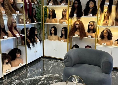 Display of diverse wigs at Remorehair in Sandton, Gauteng, ZA, showcasing stylish variety on chic mannequins.