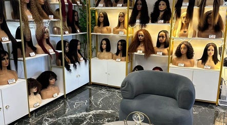 Display of diverse wigs at Remorehair in Sandton, Gauteng, ZA, showcasing stylish variety on chic mannequins.
