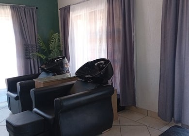 Luxurious salon chairs at Mirrors and Scissors Hair Studio, Kimberley, Northern Cape, ZA appealing for relaxation.