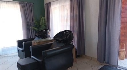 Luxurious salon chairs at Mirrors and Scissors Hair Studio, Kimberley, Northern Cape, ZA appealing for relaxation.