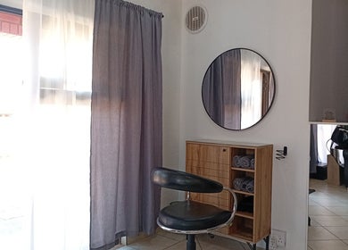 Modern hair styling station at Mirrors and Scissors Hair Studio in Kimberley, Northern Cape, ZA.