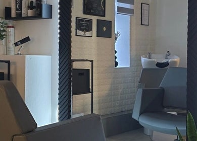 Stylish seating and decor at Vega Complete Hair Care in Durham, England, GB, enhancing wellness and relaxation.