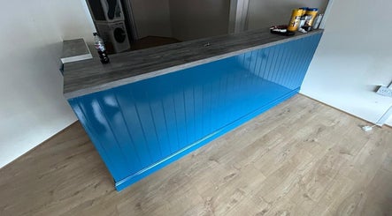 Reception area at Shampooched, featuring a blue counter in Croydon, England, GB.
