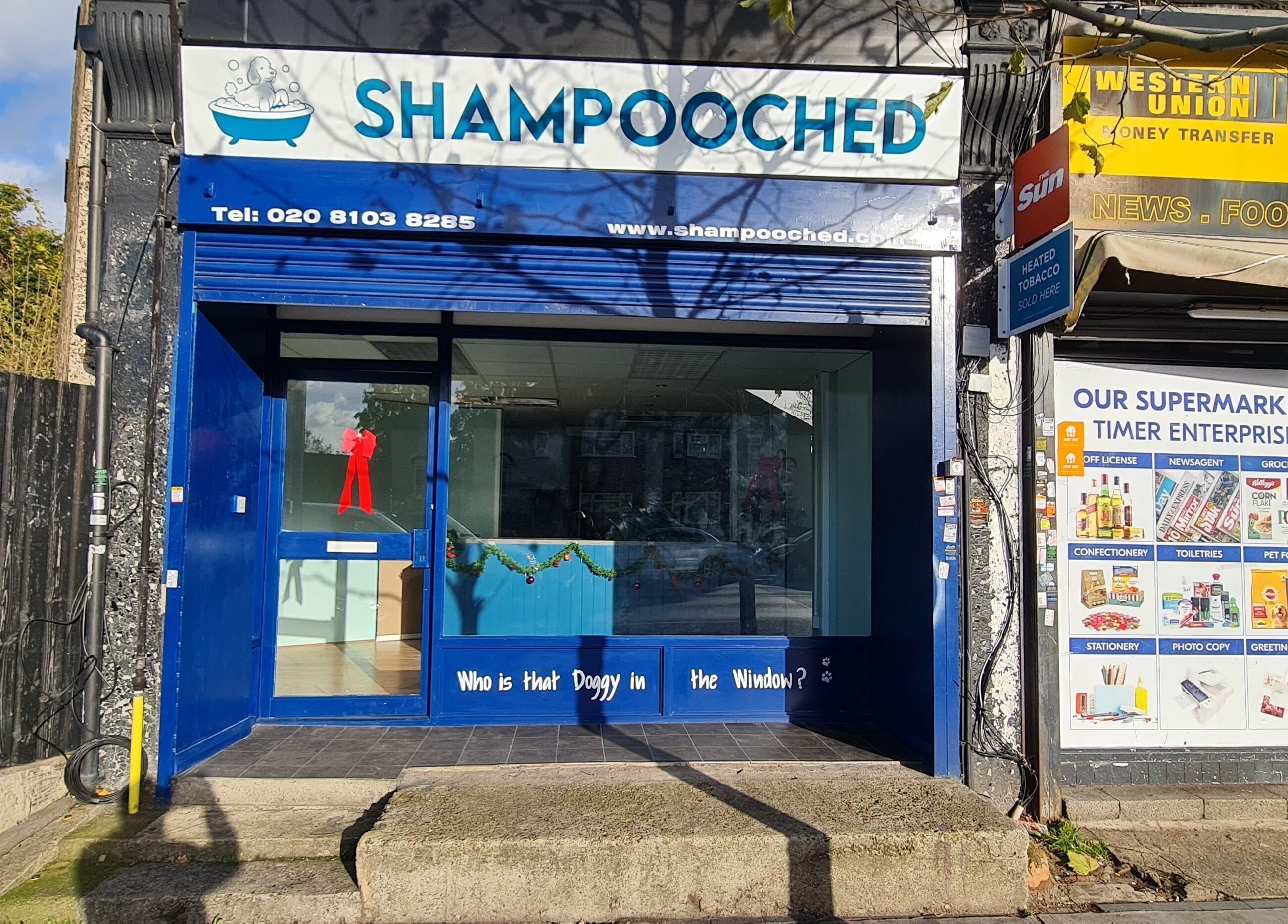 Front view of Shampooched in Croydon, England, GB. Blue facade with signage and decorative elements.