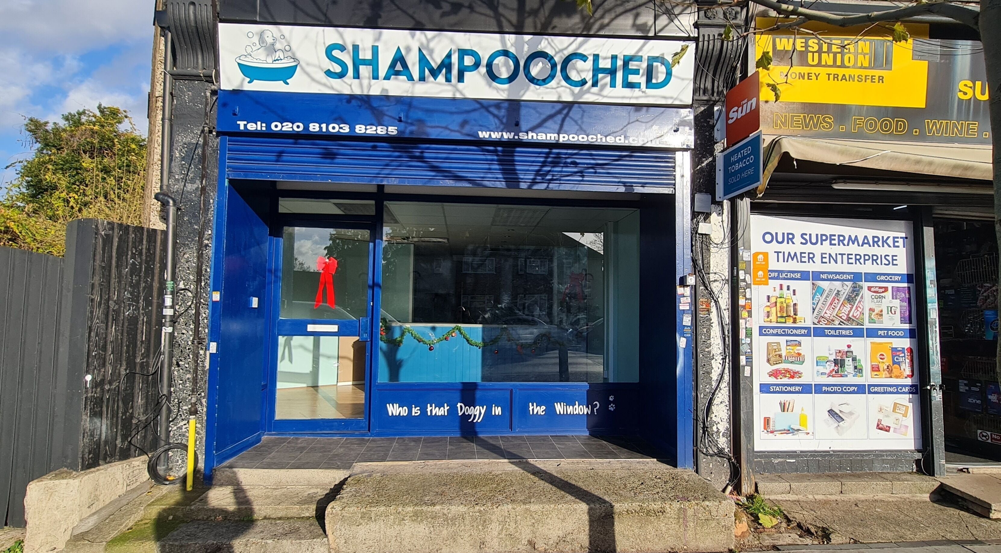 Front view of Shampooched in Croydon, England, GB. Blue facade with signage and decorative elements.