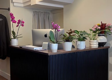 Reception area with orchids and modern decor at Henko Studio, London, England, GB.