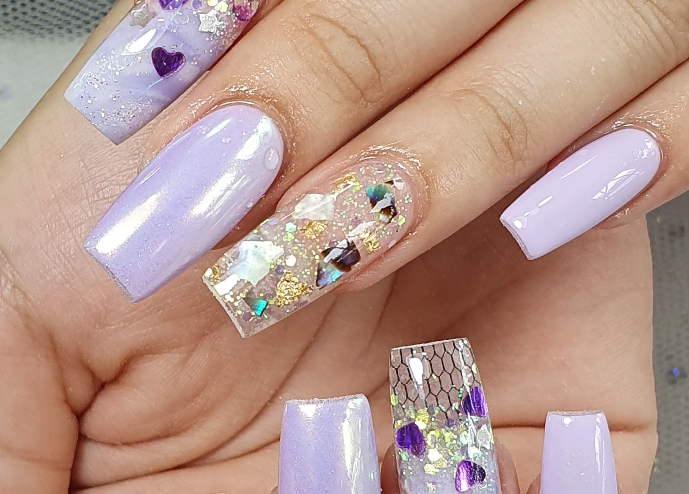 Close-up of lavender nail art with glitter at Sandy Nails And Headspa Therapy, Cabramatta, New South Wales, AU.