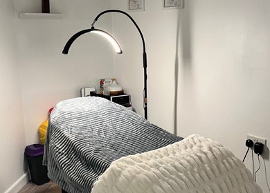 Comfortable treatment room at Ella’s Beauty Lounge in Briercliffe, England, GB, showcasing a relaxing setup.