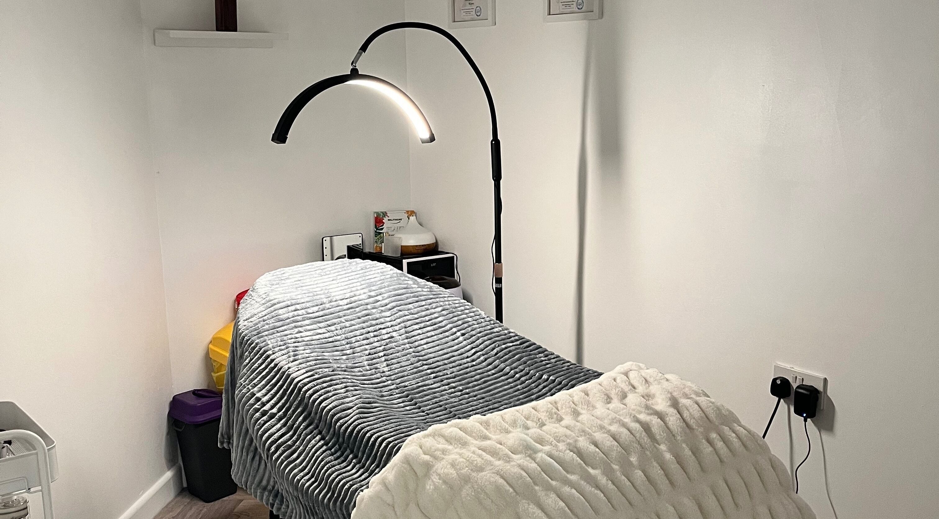 Comfortable treatment room at Ella’s Beauty Lounge in Briercliffe, England, GB, showcasing a relaxing setup.