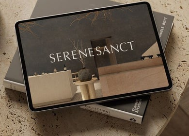 Tablet showing SereneSanct Massage & Spa's sleek design, Phuket, TH, resting on a textured surface.