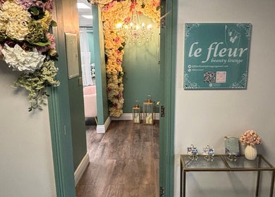 Chic floral entrance of Le Fleur Beauty Lounge in Cork, County Cork, IE, showcasing elegant decor and signage.
