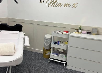 Relaxing treatment room at Glow Up Tanning & Beauty Downham, Downham Market, England, GB with a plush bed and organized tools.