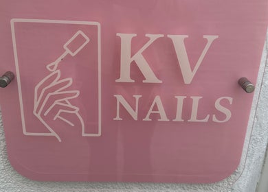 KvNails sign in Portsmouth, England, GB, featuring stylish nail art logo against a pink background.