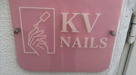 KvNails sign in Portsmouth, England, GB, featuring stylish nail art logo against a pink background.