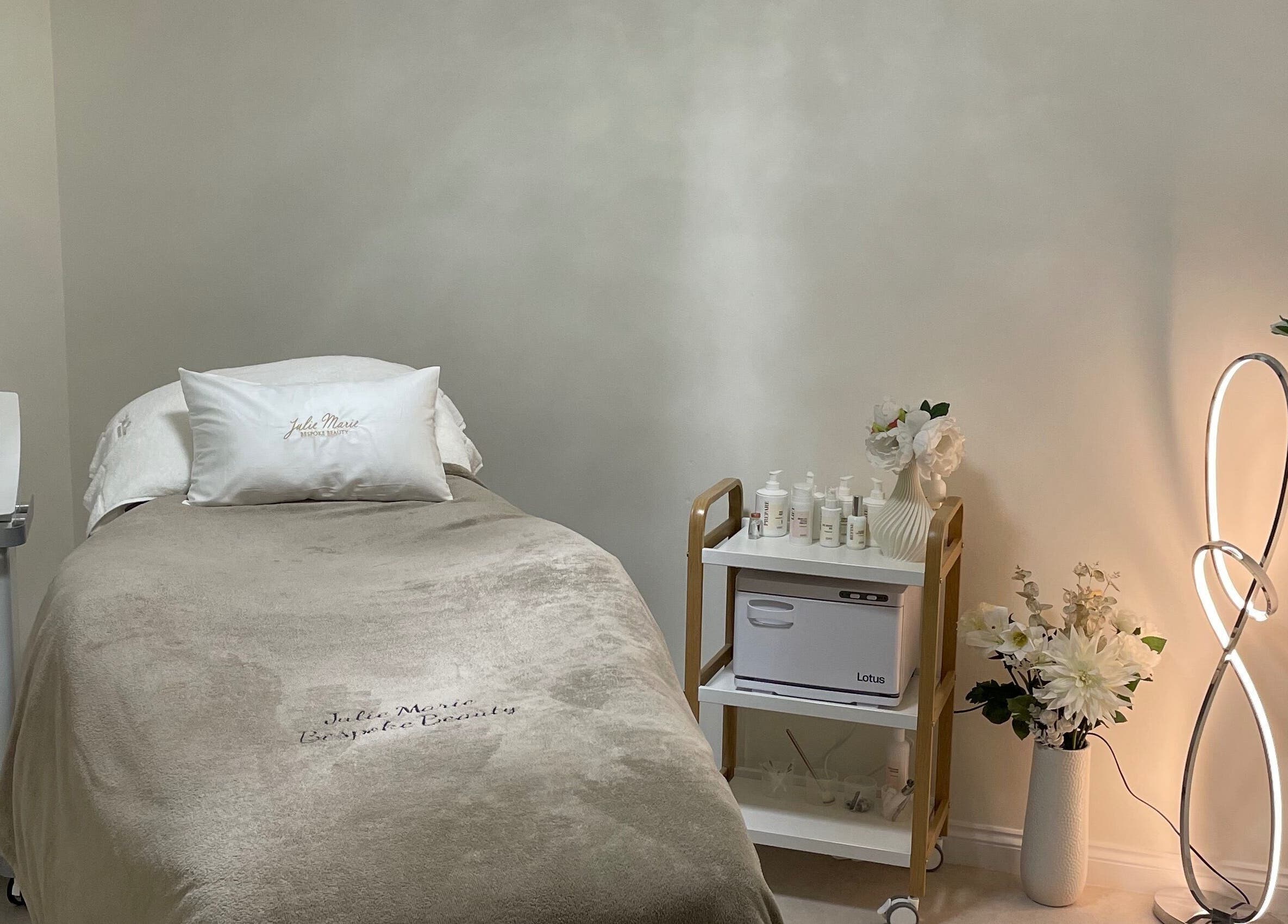 Tranquil treatment room at Julie Marie Bespoke Beauty, Dunbar, Scotland, GB with sleek CACI machine.