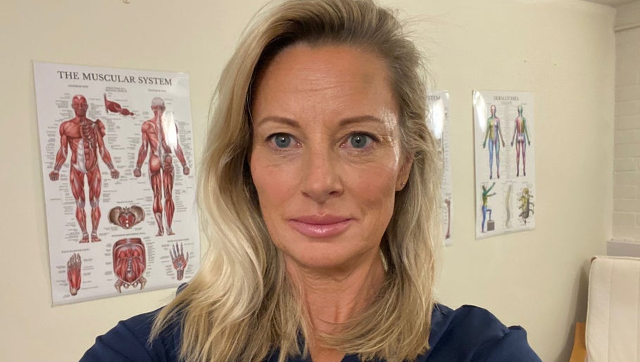 Professional at PHYZIFIT @ The Exercise Lounge, Howberry Park, Wallingford, England, GB with anatomical posters.