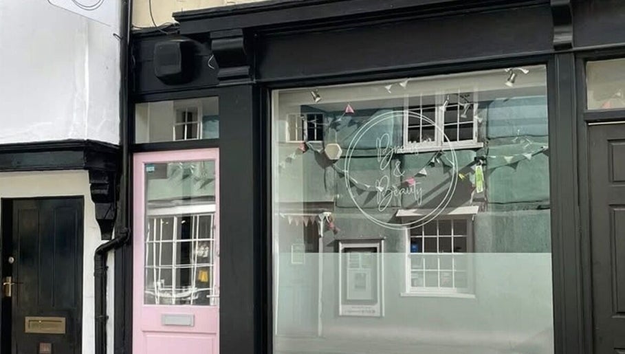 Exterior of Glo & Co beauty venue with a stylish glass front in Wallingford, England, GB.