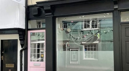 Exterior of Glo & Co beauty venue with a stylish glass front in Wallingford, England, GB.