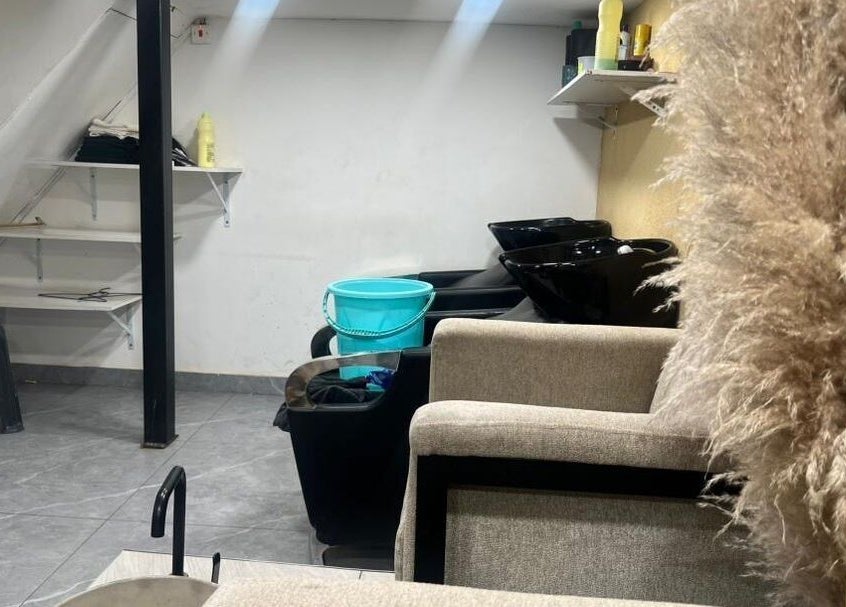 Spacious wash area at Valued Nails, Lusaka, Lusaka Province, ZM, featuring stylish black wash basins.