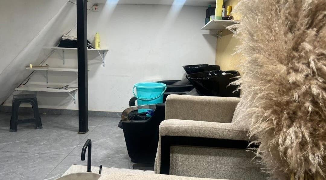 Spacious wash area at Valued Nails, Lusaka, Lusaka Province, ZM, featuring stylish black wash basins.