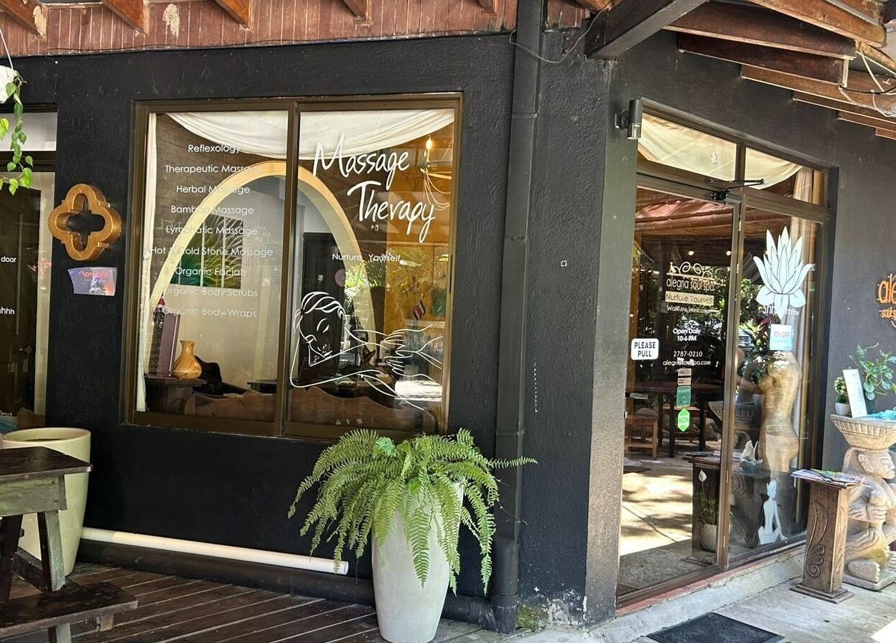 Entrance of Alegria Soul Spa, Puntarenas, featuring massage therapy signage and inviting decor.
