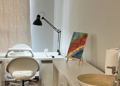 Cozy nail station at NailedbyNehita in Toronto, Ontario, CA, featuring bright decor and modern equipment.