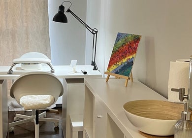 Elegant nail station at NailedbyNehita, Toronto, Ontario, CA with art and modern decor.